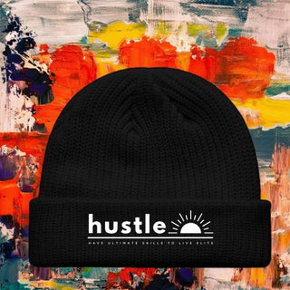 My Store H2Elite black fisherman beanie with white Hustle graphic against a vibrant abstract painted background.