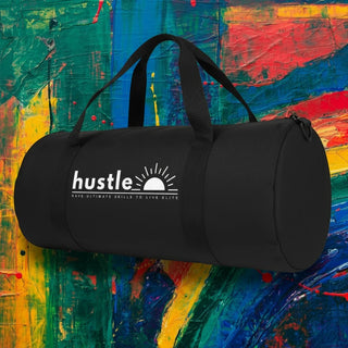 My Store H2Elite heavyweight black cotton canvas duffel bag with white Hustle graphic against a colorful background.