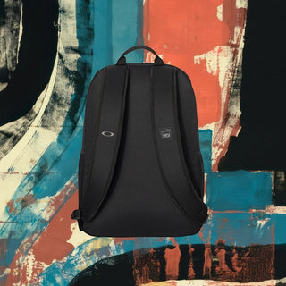 My Store H2Elite 22L Method 360 Ellipse black backpack with ergonomic shoulder straps against abstract background.