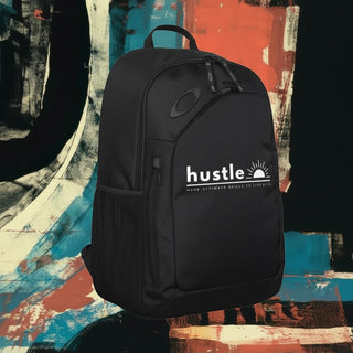 My Store H2Elite 22L Method 360 Ellipse black backpack with white hustle graphic against an abstract painted background.