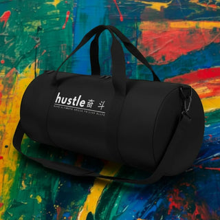 My Store H2Elite heavyweight black cotton canvas duffel bag with white Hustle graphic against a colorful abstract background