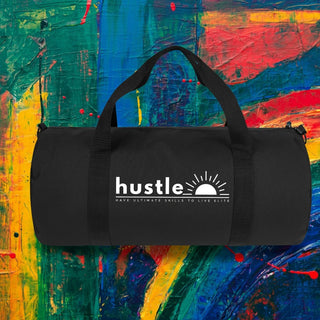 My Store H2Elite heavyweight black cotton canvas duffel bag with white Hustle graphic against abstract art background.
