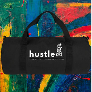 My Store H2Elite heavyweight black cotton canvas duffel bag with white Hustle graphic against abstract colorful art.