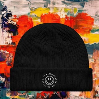 My Store H2Elite™ black fisherman beanie with a white circular smiley face logo on the fold-over cuff.