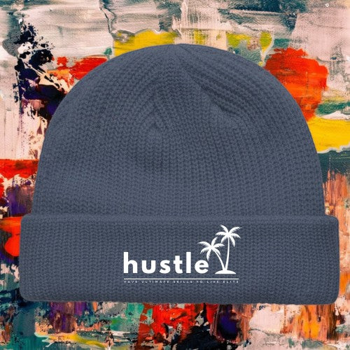 My Store H2Elite Fisherman Beanie in charcoal grey with white Hustle palm tree graphic on a colorful abstract background
